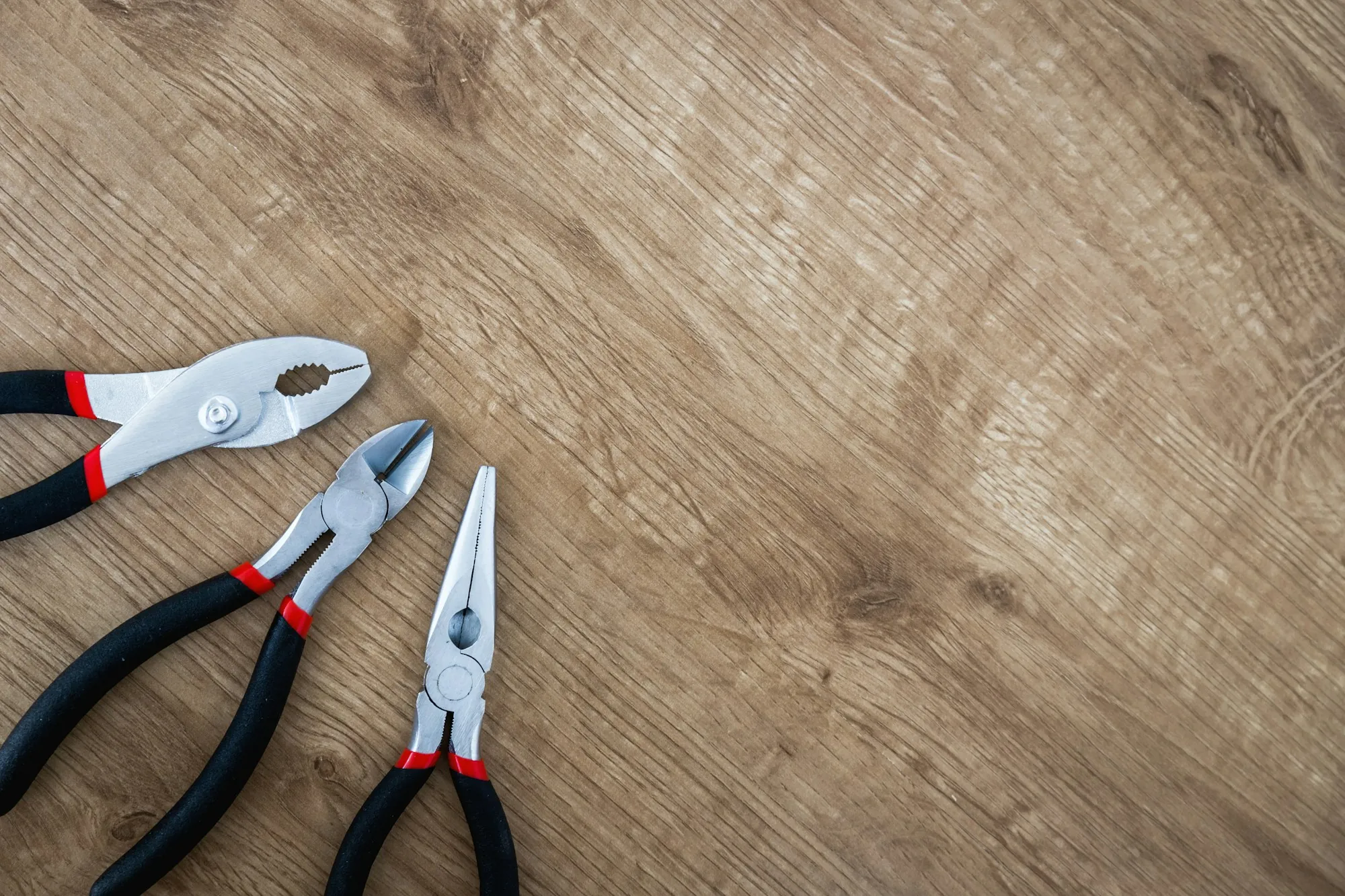 Electrician's pliers laid out on a work surface